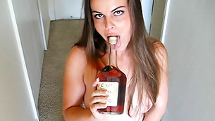 Dirty girl is going to pleasure her muffin with a bottle